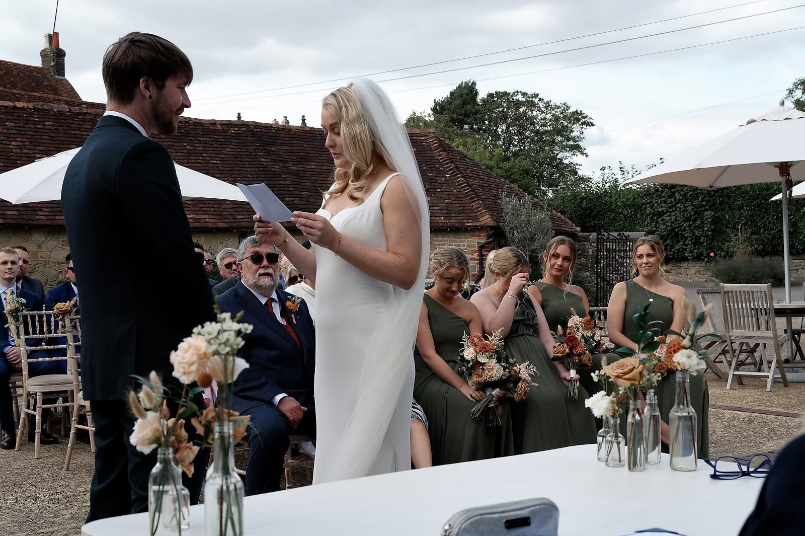 Bride reading her handwritten vows to the groom during their Fitzleroi Barn ceremony