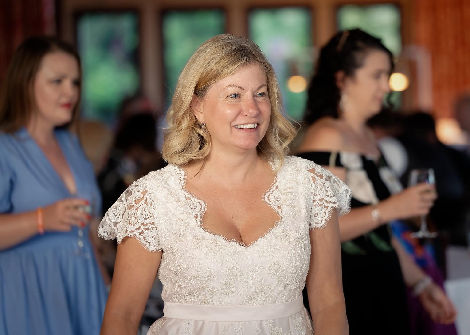 Bride smiling during the evening reception at South Lodge Hotel, Horsham, West Sussex