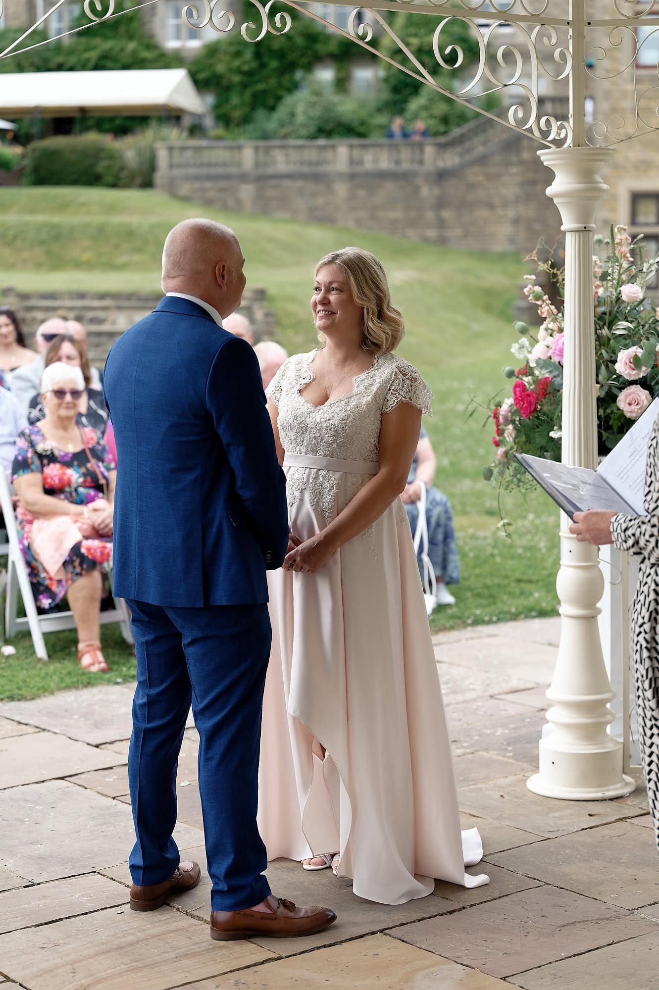 Bride and groom during their outdoor wedding ceremony at the Pavilion, South Lodge Hotel, Horsham, West Sussex