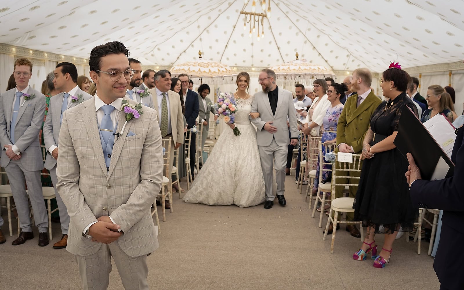 Groom reaction as bride arrives for ceremony at Trading Boundaries wedding
