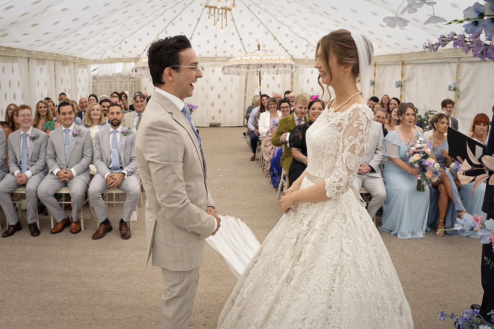 Guests watching ceremony inside marquee at Trading Boundaries Sussex