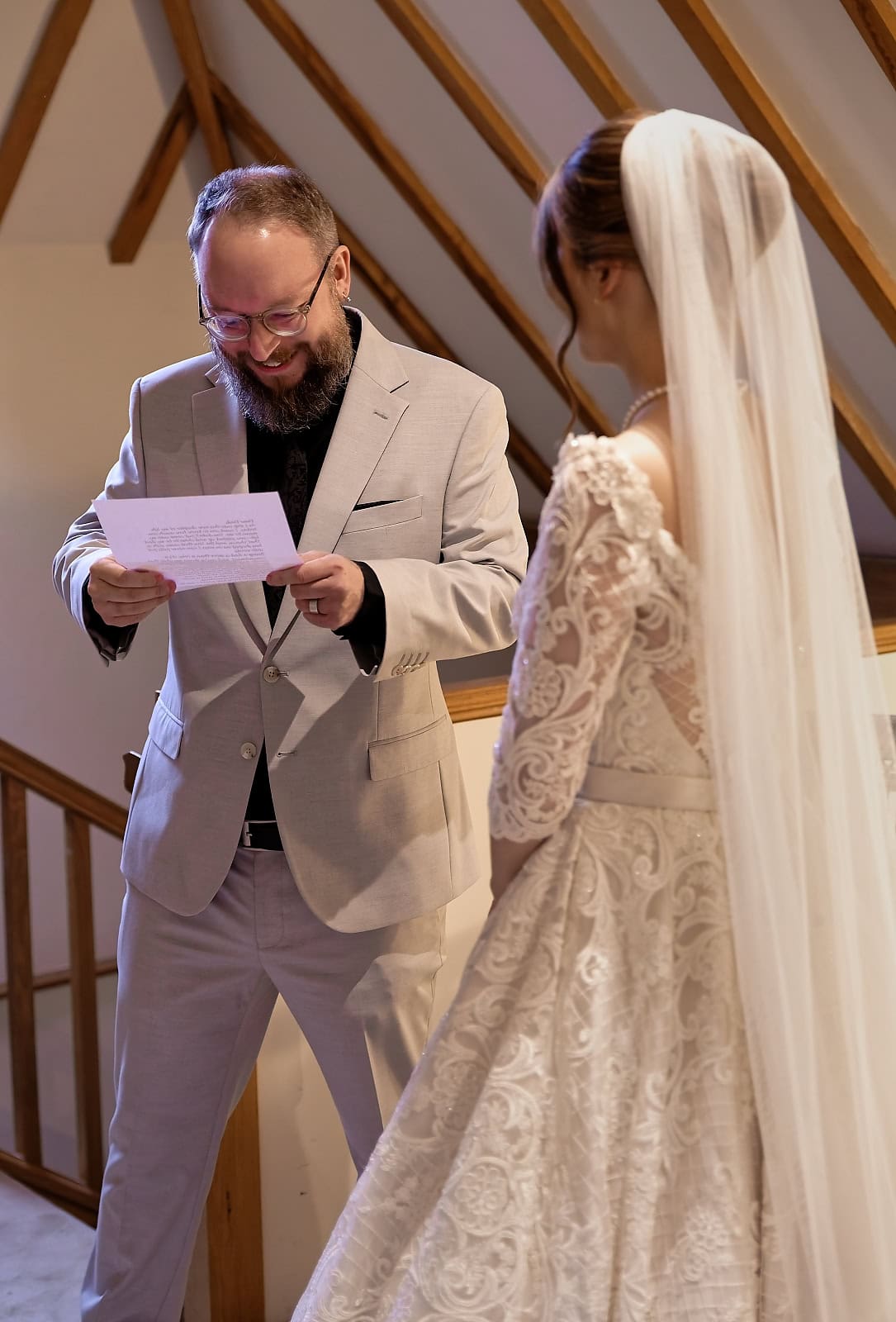 Father reading heartfelt letter during bride first look moment Sussex wedding