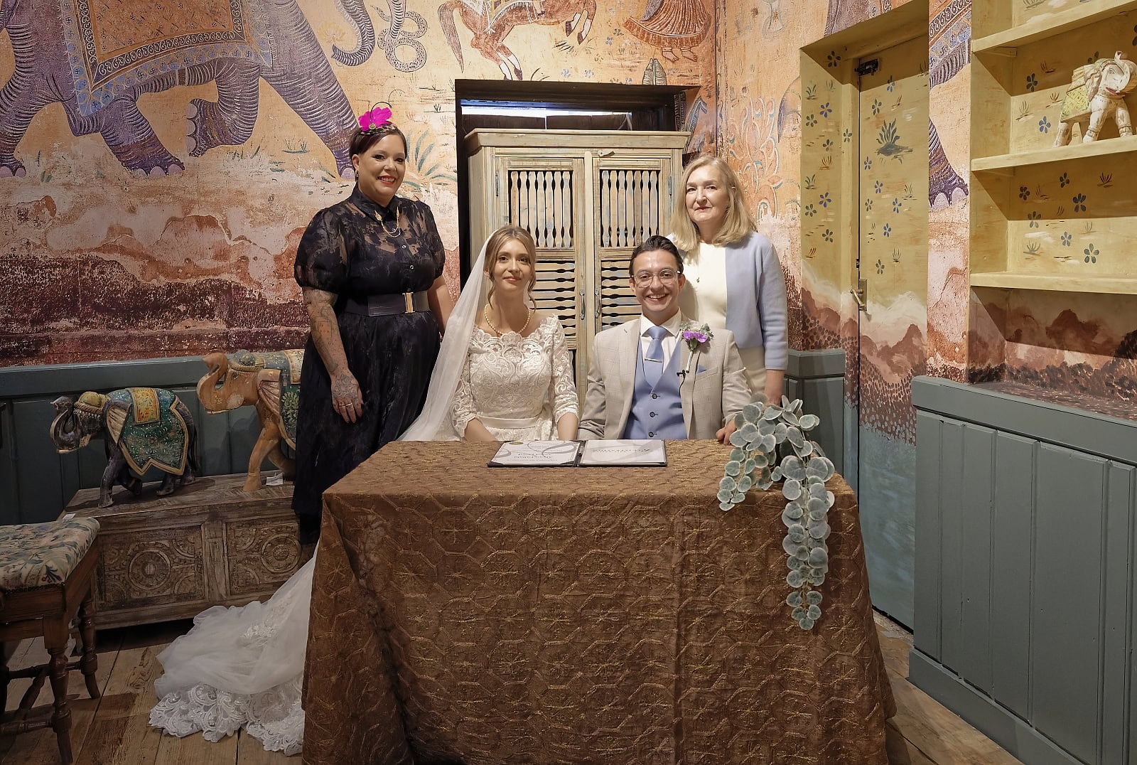 Wedding register signing with bride groom and witnesses at Trading Boundaries Sussex