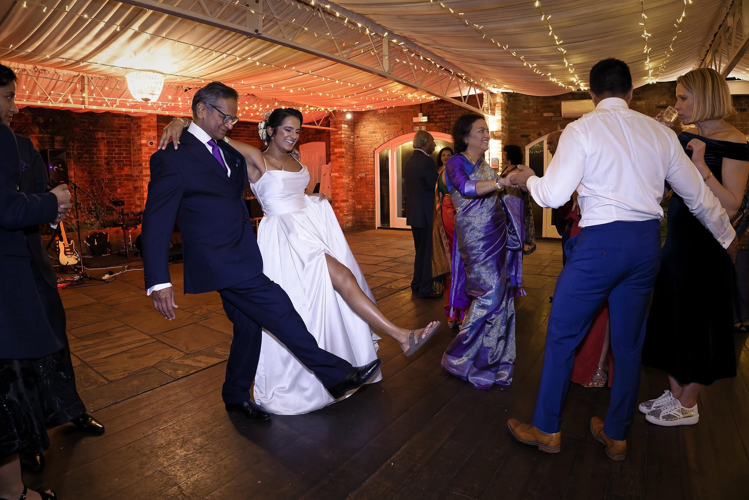Bride dancing with her father on the dance floor in the Orangery at Northbrook Park wedding venue in Hampshire by Andy Kerr Photography