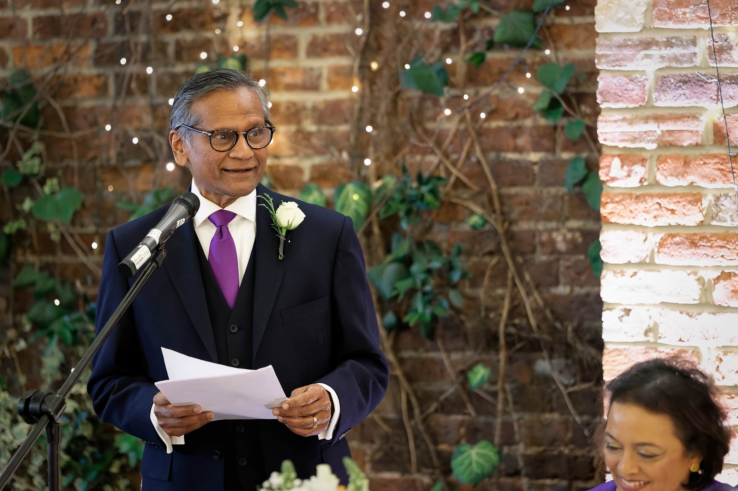 Father of the bride delivering his wedding speech in the Orangery at Northbrook Park wedding venue in Hampshire by Andy Kerr Photography