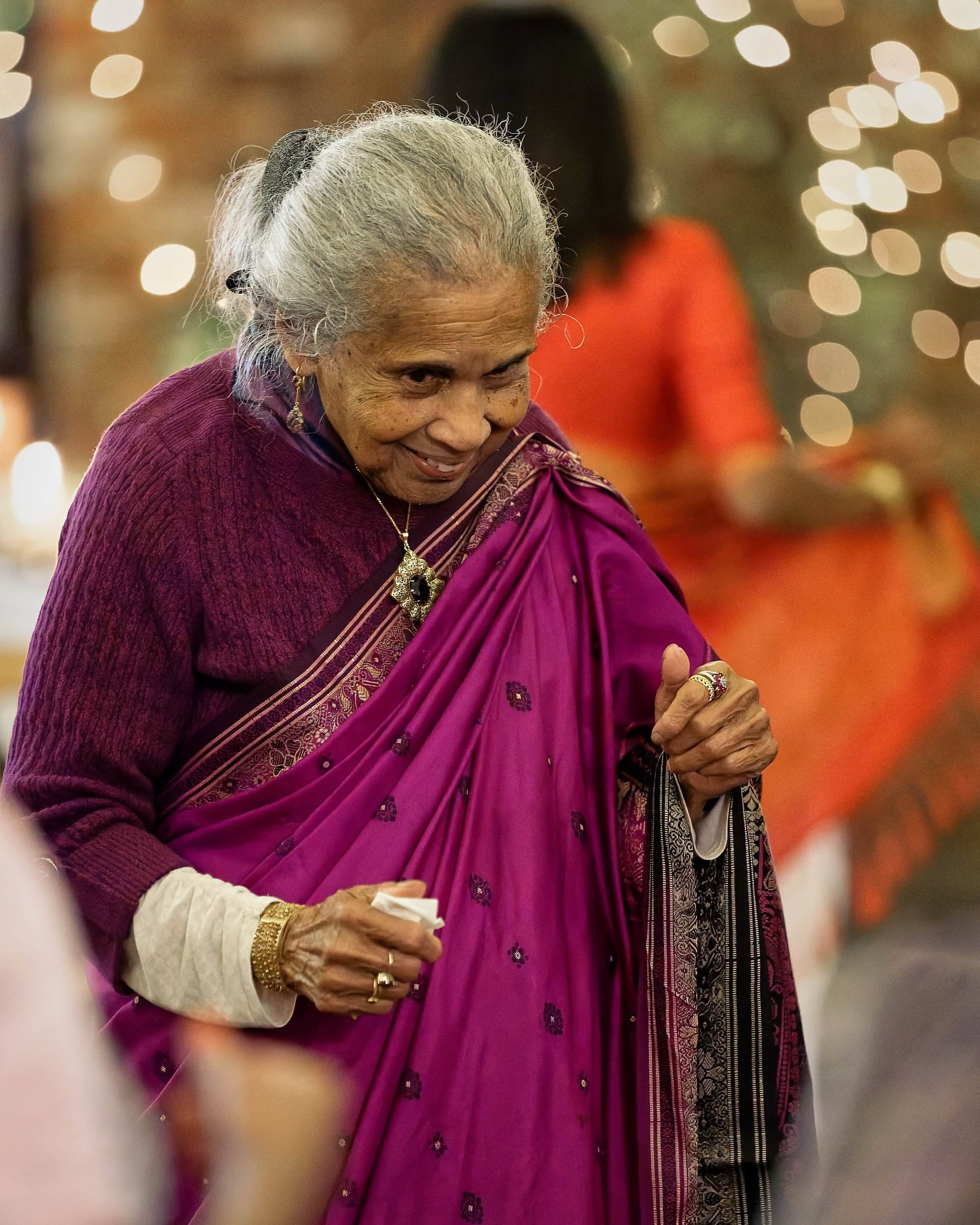 Grandmother dancing during the evening reception in the Orangery at Northbrook Park wedding venue in Hampshire by Andy Kerr Photography
