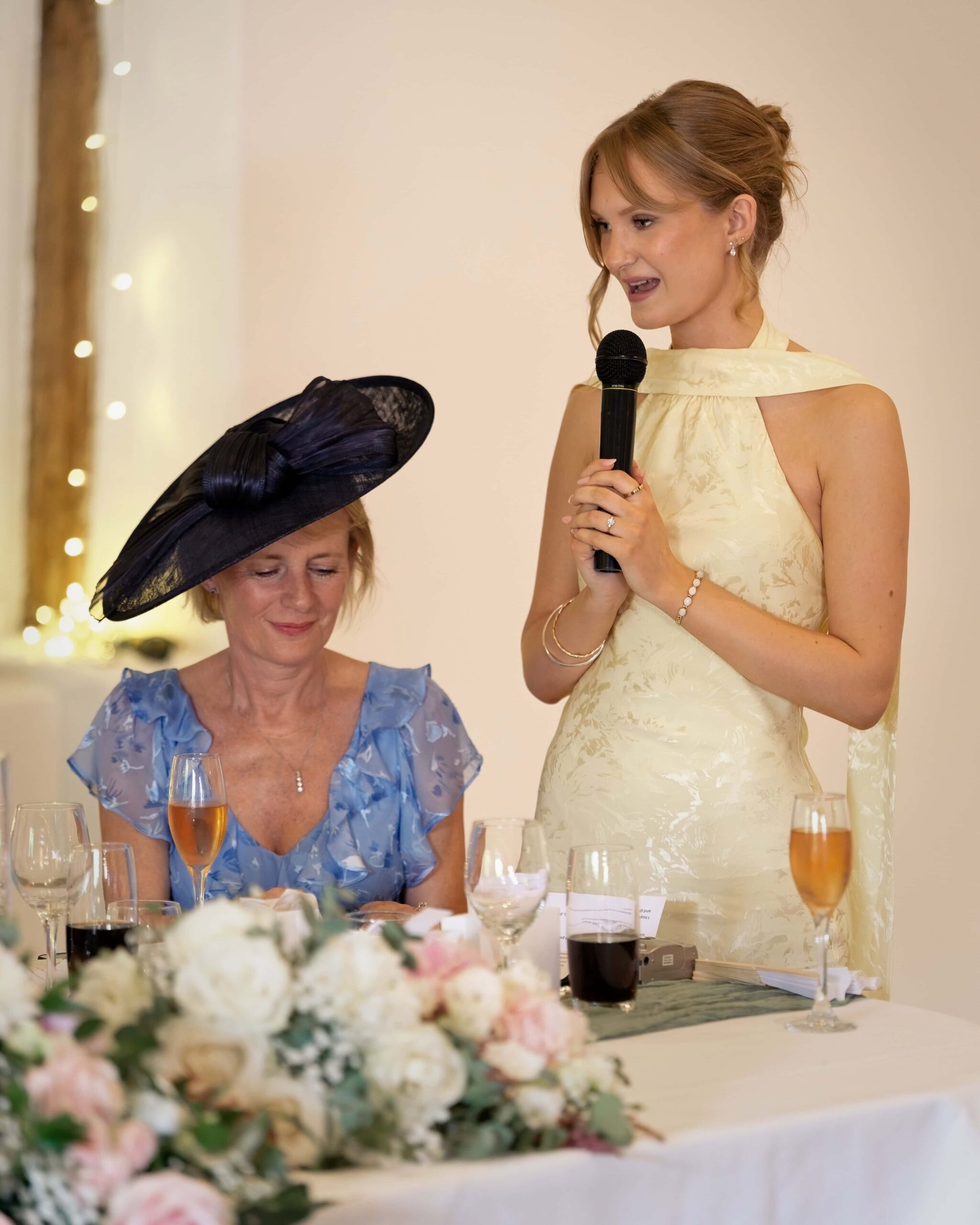 Fitzleroi Barn wedding photographer image of a bridesmaid giving her speech at the wedding reception