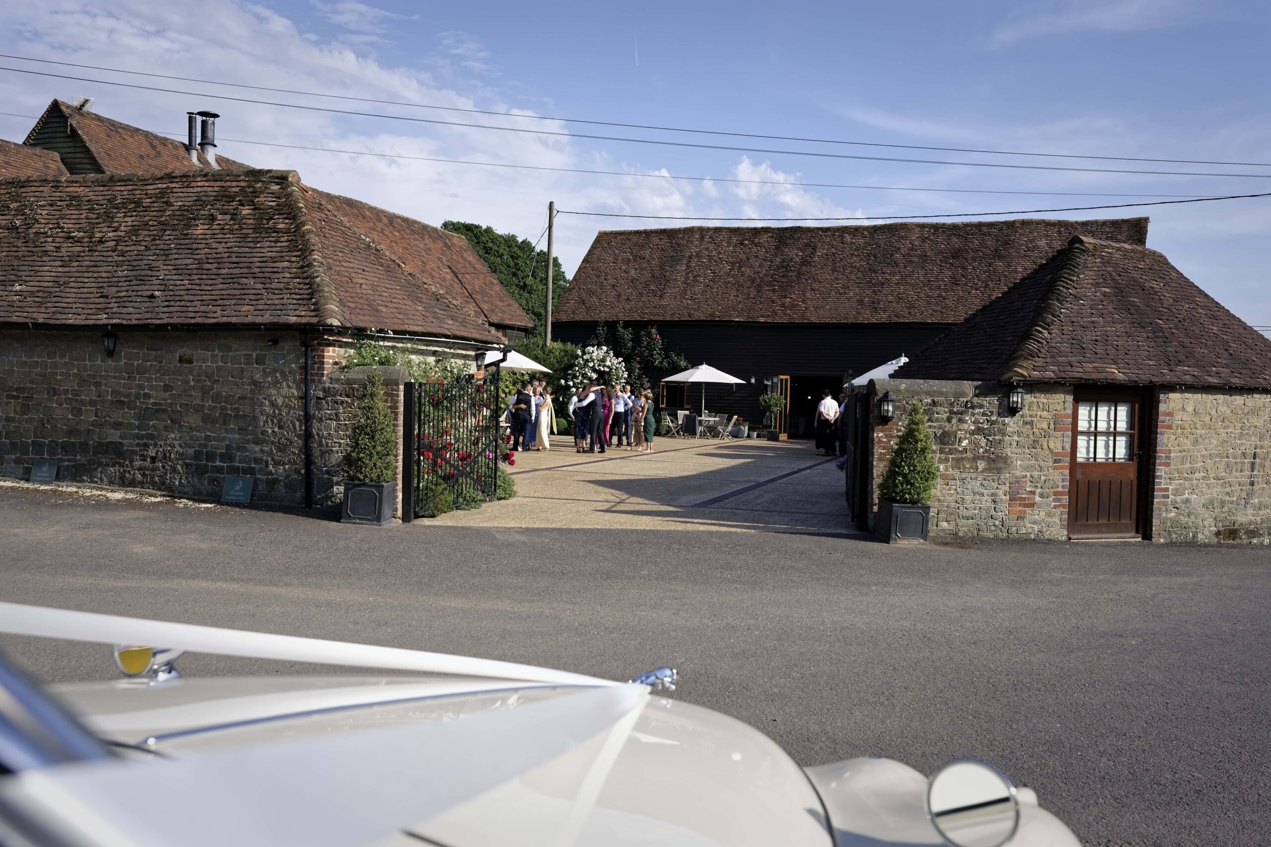 Fitzleroi Barn wedding photographer exterior view of the venue's courtyard and traditional Sussex barns