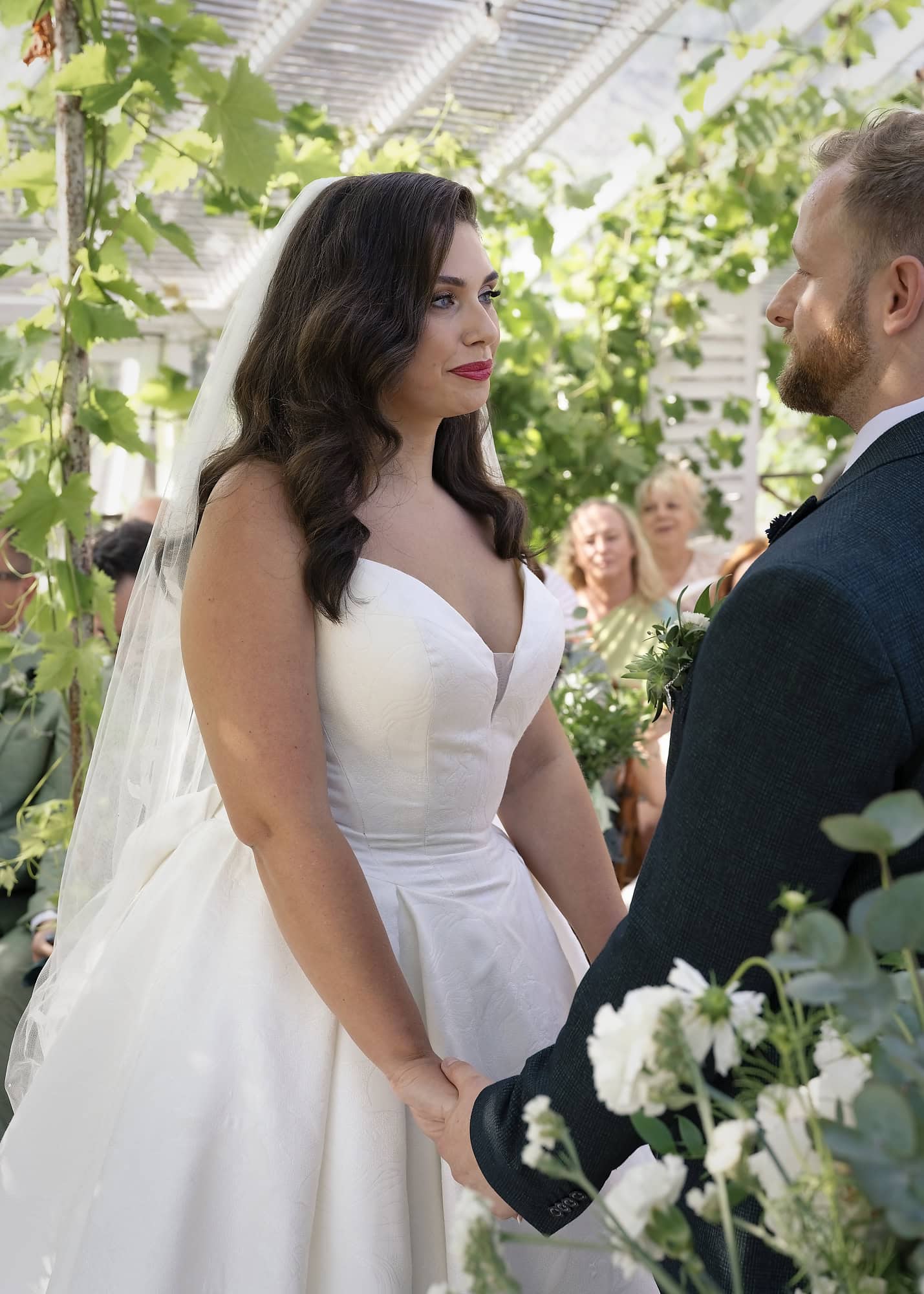 Close-up of the bride and groom sharing an emotional moment during the ceremony