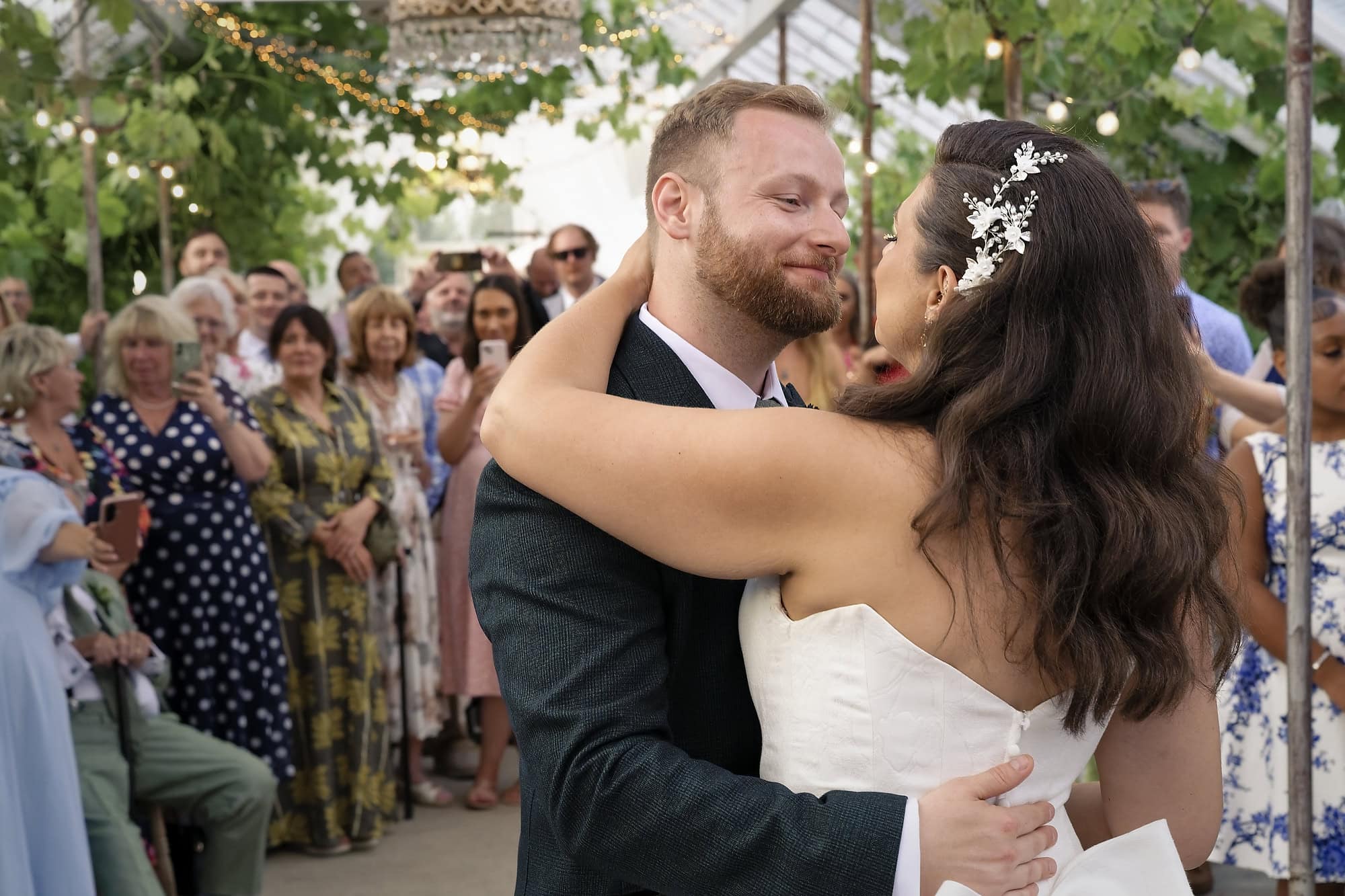 Close-up of the groom smiling at his bride during their first dance