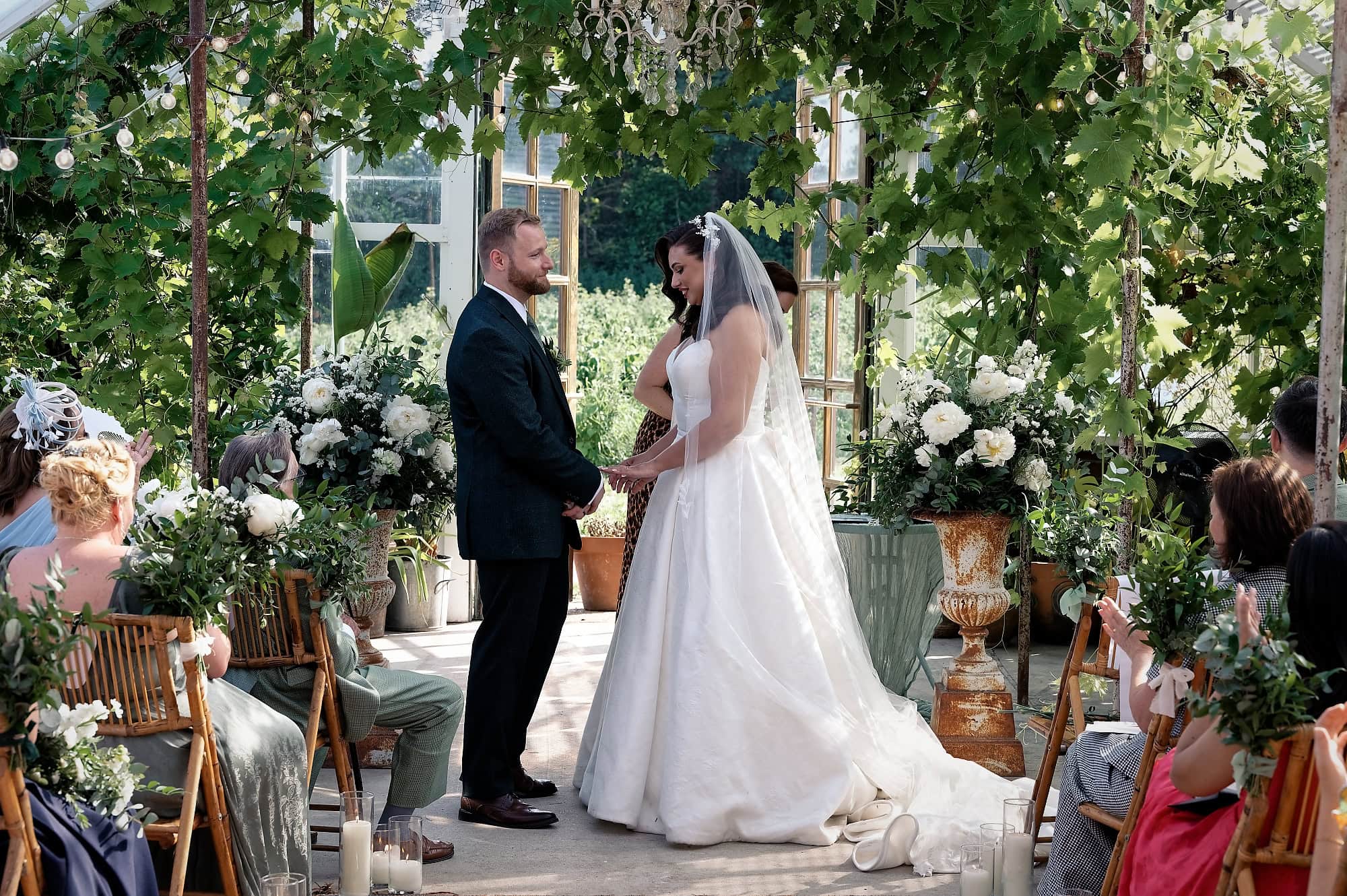 Bride admiring the ring on here hand during wedding ceremony at Spring Gardens