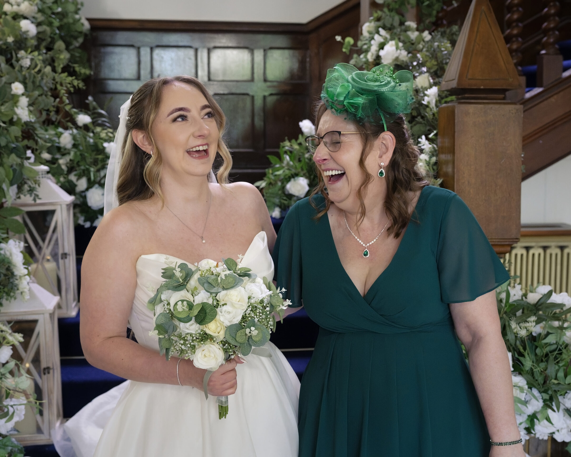 Bride sharing a laugh with her mother before the ceremony at Highley Manor