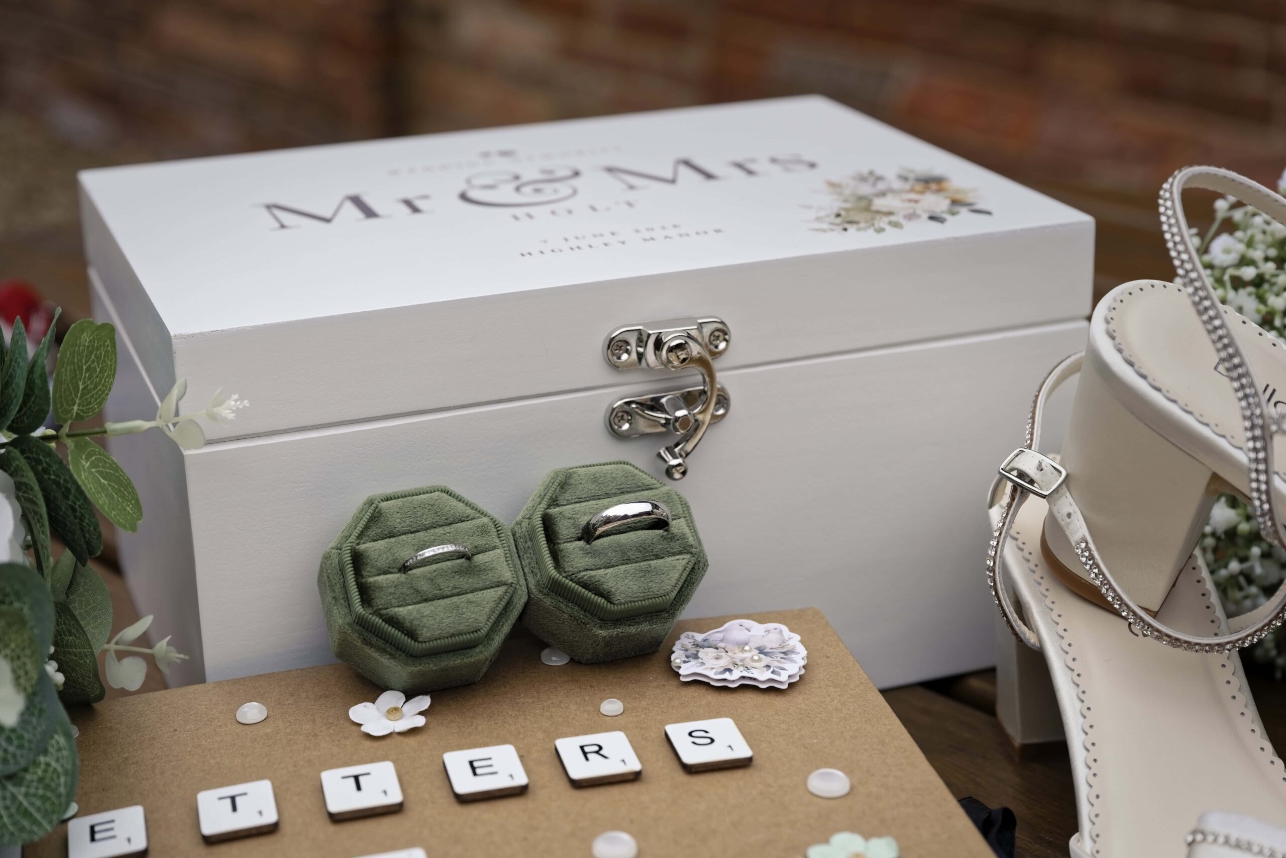 Personalised Mr and Mrs keepsake box with wedding rings and bridal shoes at Highley Manor
