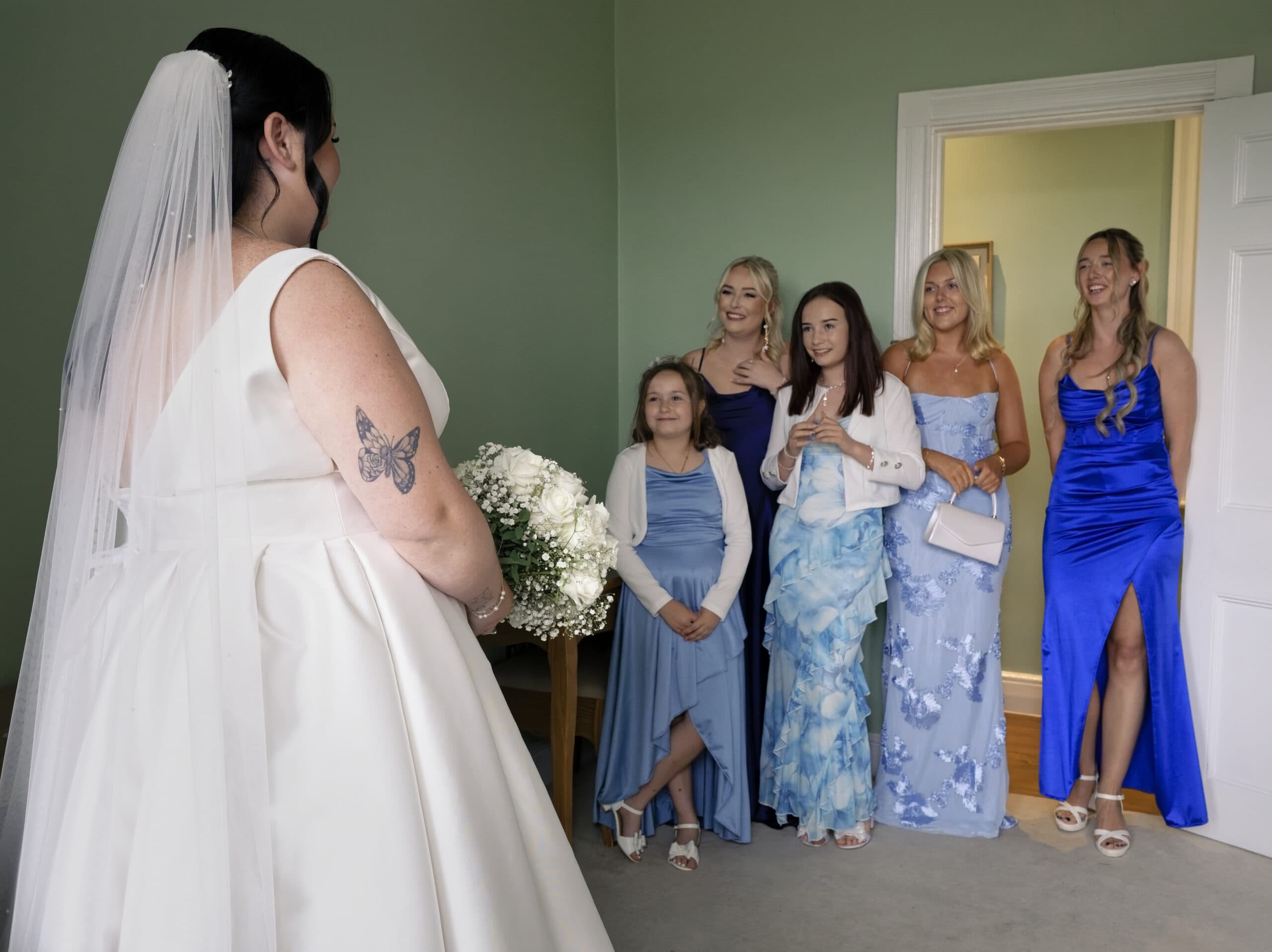 Bride's first look with her something blue crew before the ceremony