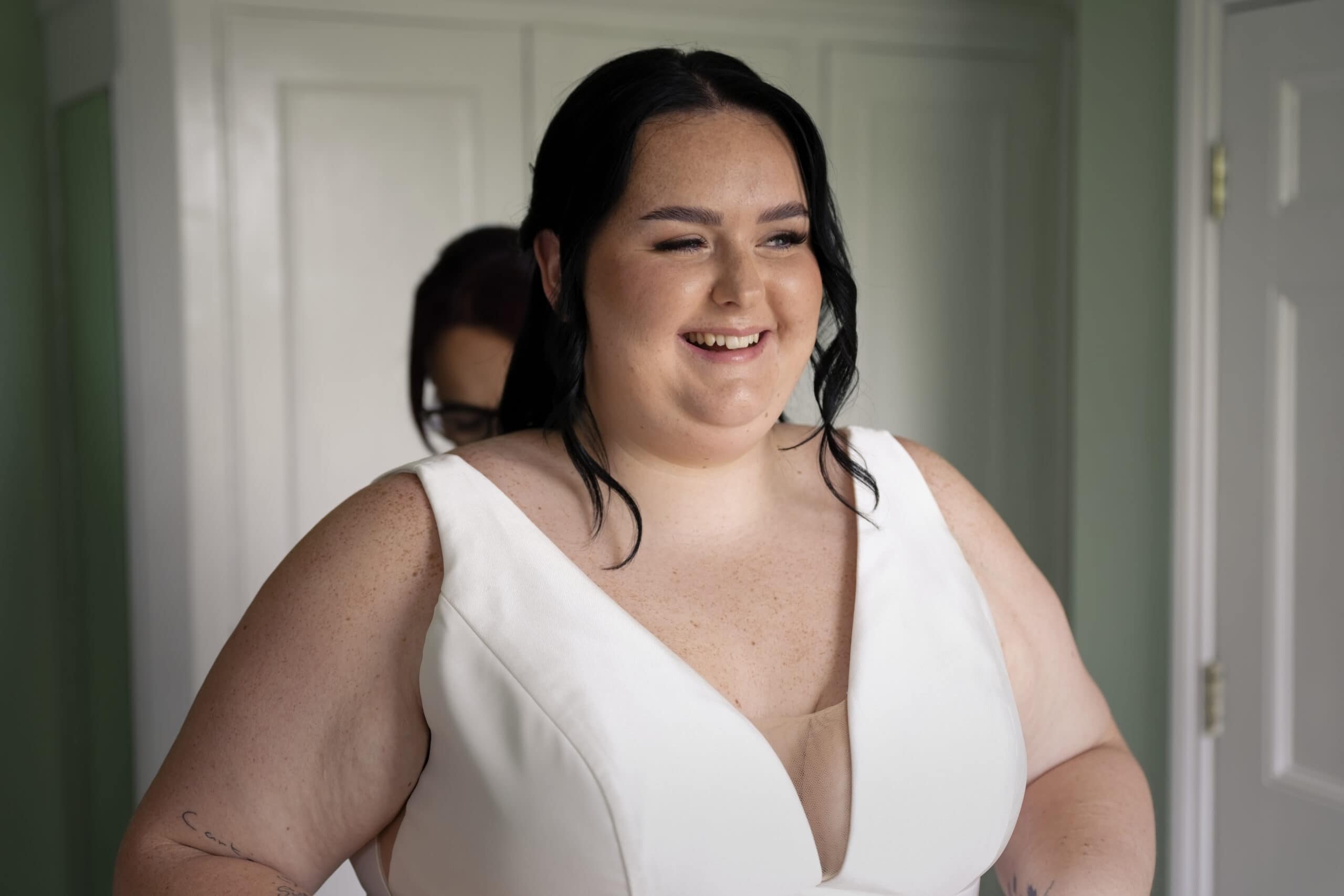 Bride laughing during bridal preparations at Northbrook Park