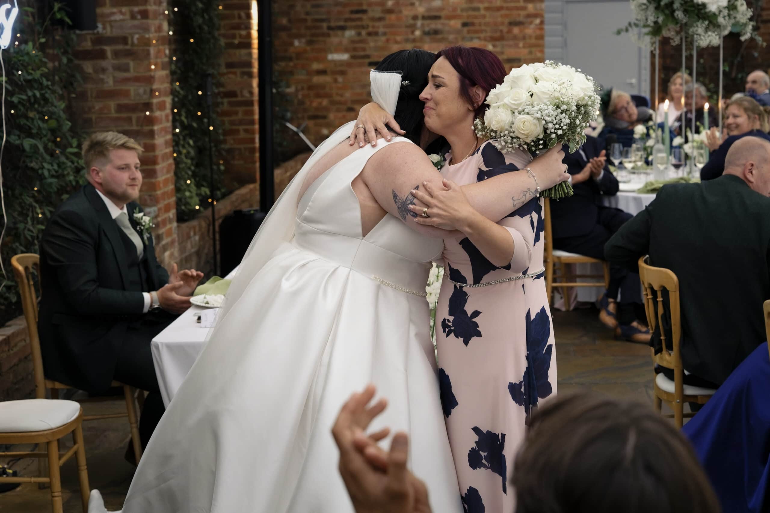 Bride embracing her mum during the speeches