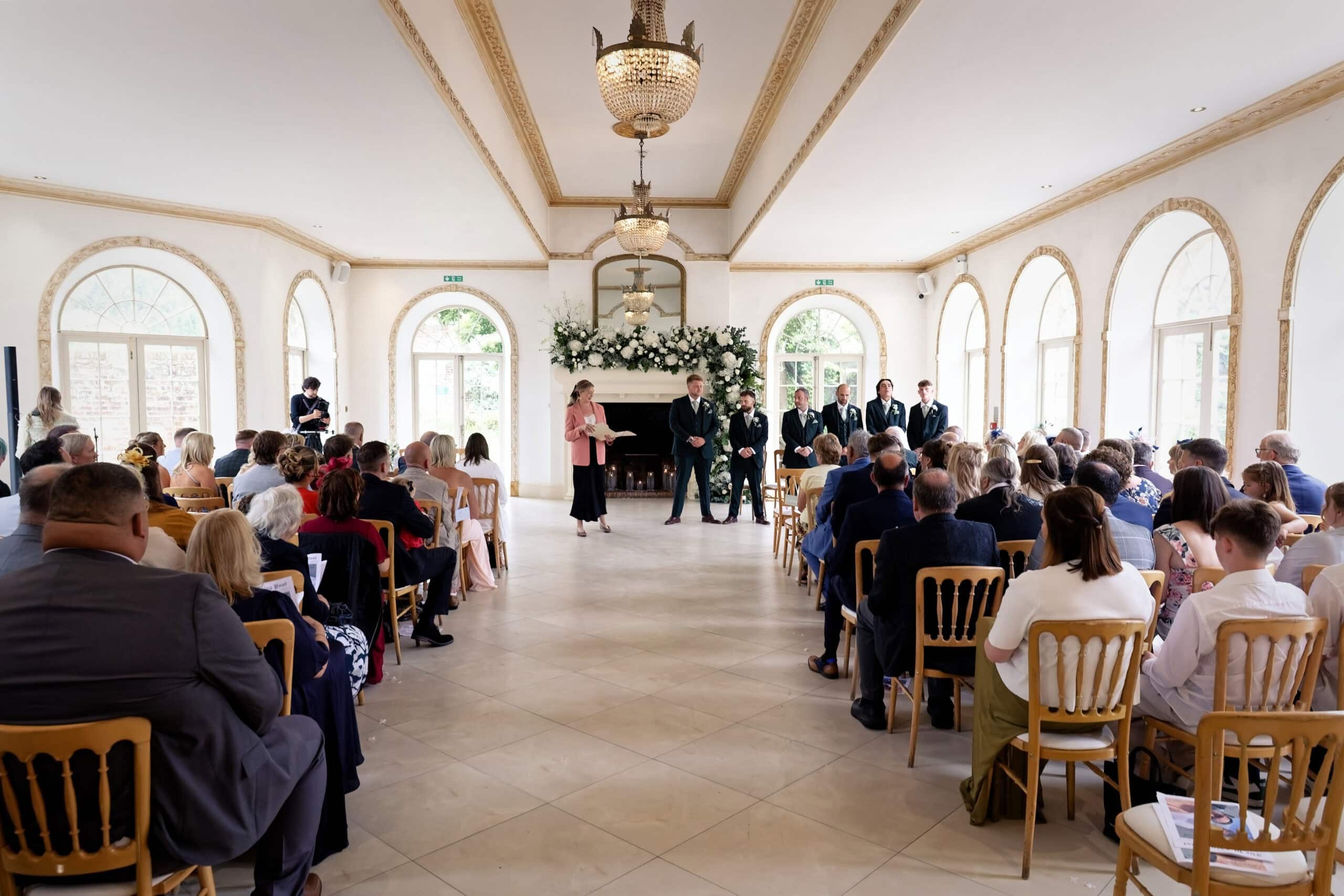 Wide ceremony shot taken from the back of the Vine Room