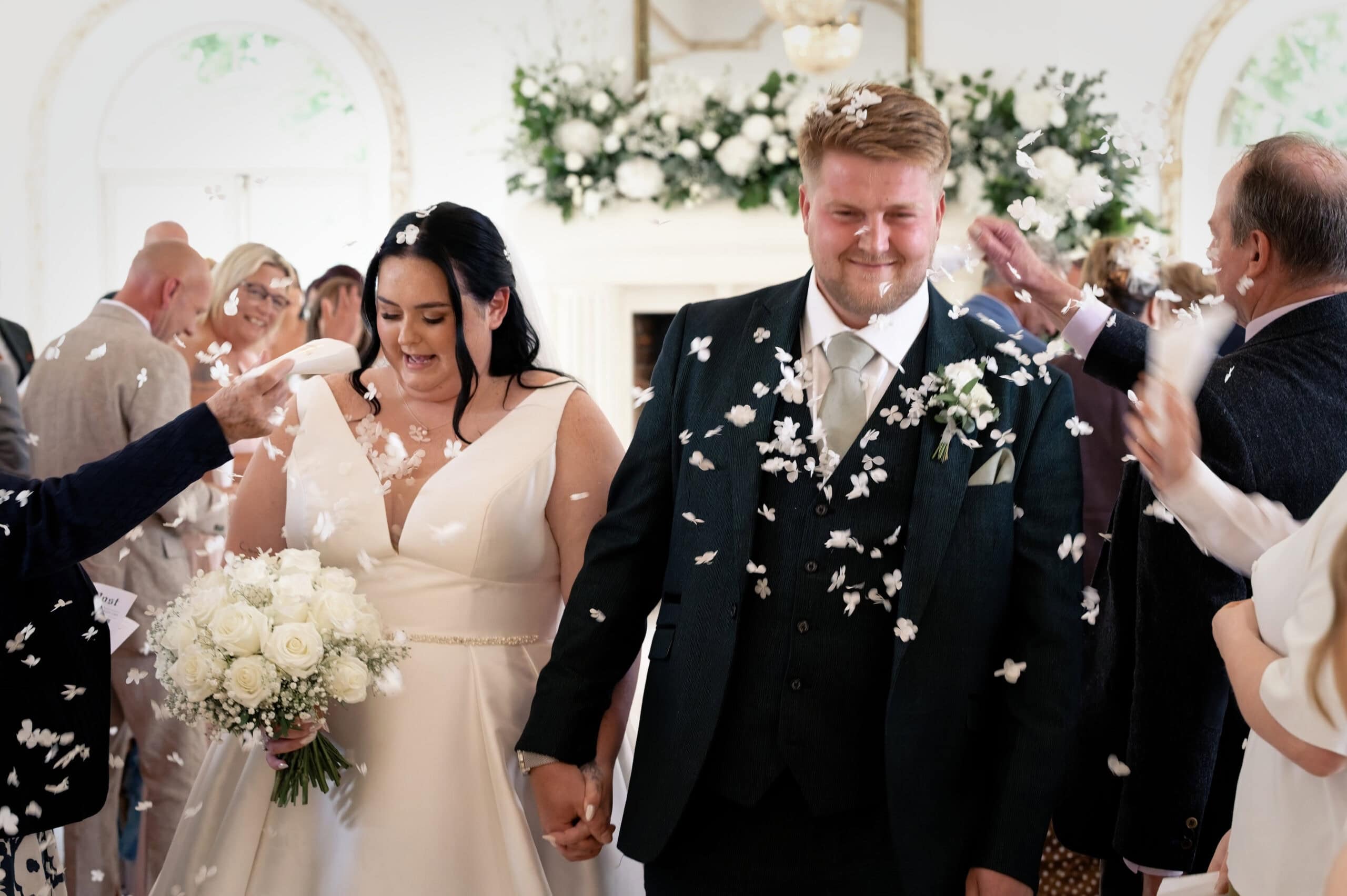 Confetti exit for the newlyweds outside Northbrook Park
