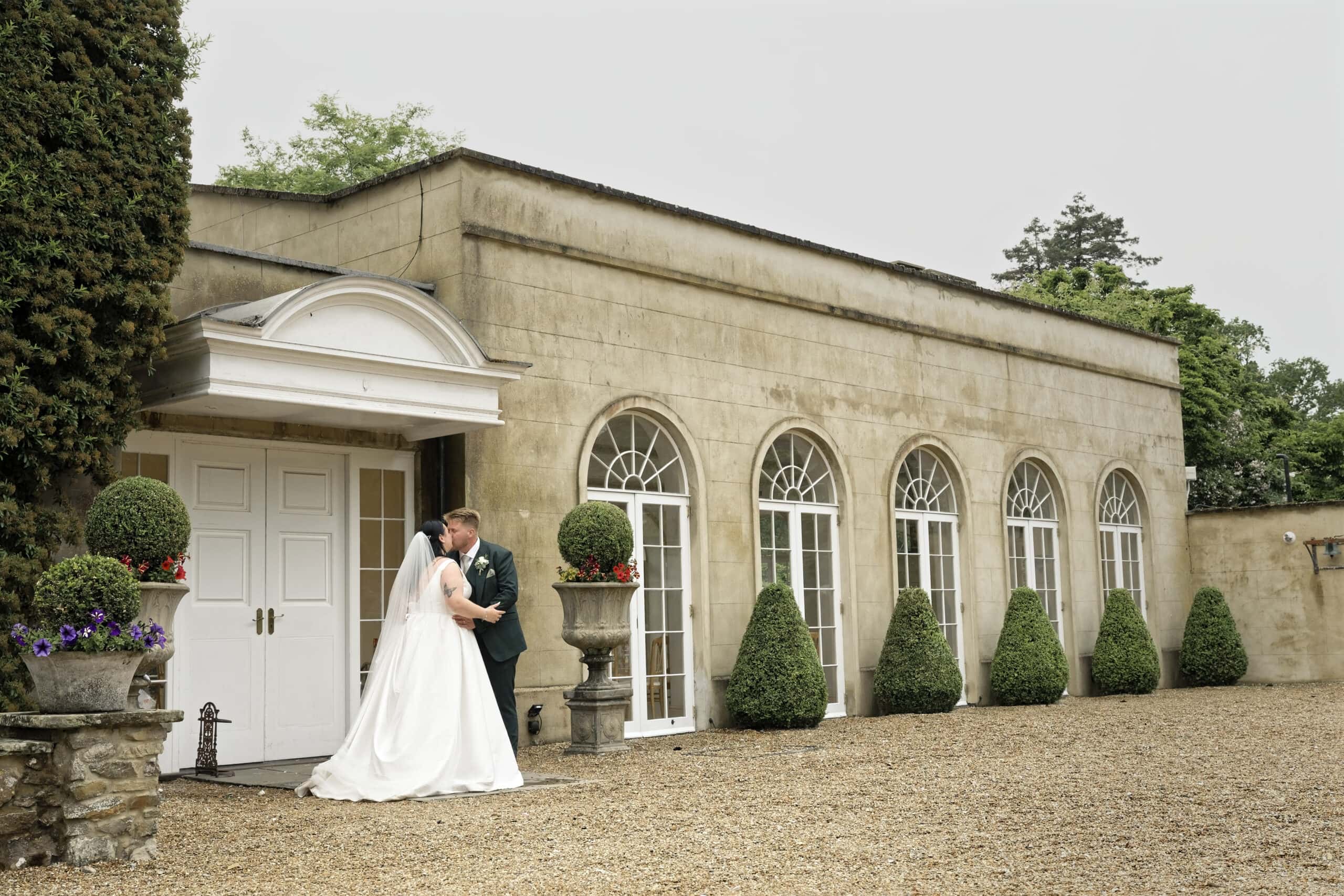 Bride and groom portrait outside the Northbrook Park orangery