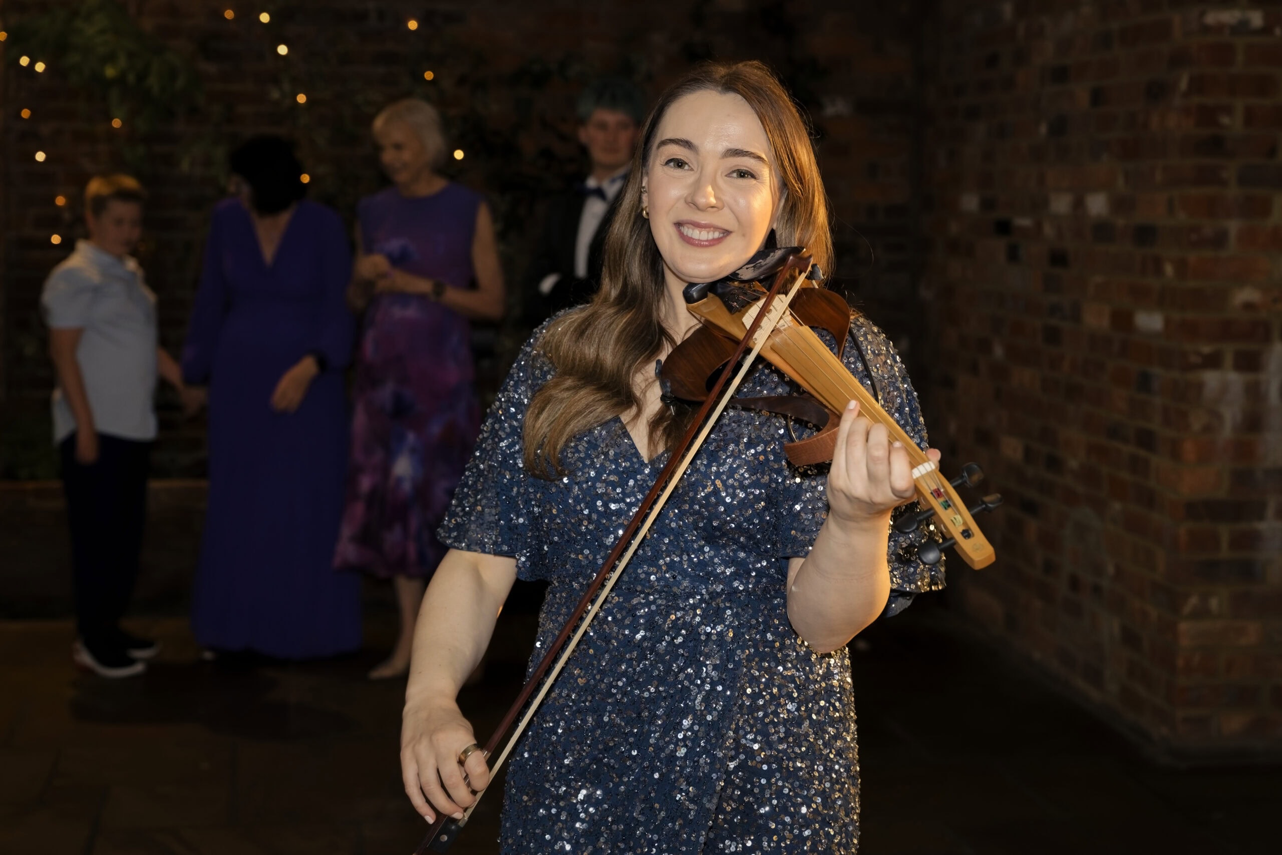 Violinist performing during the evening reception