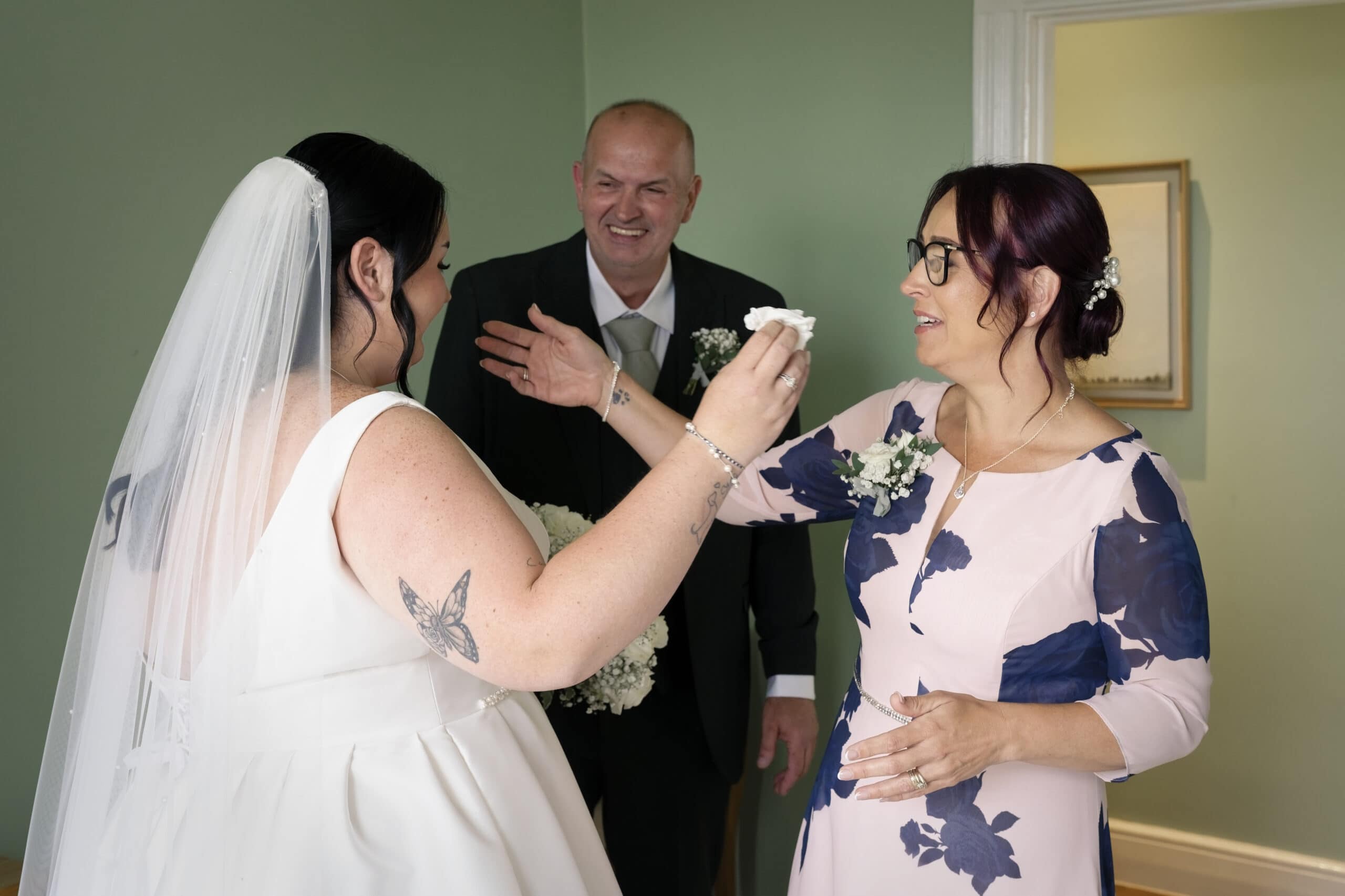 Father and daughter embrace during an emotional first look