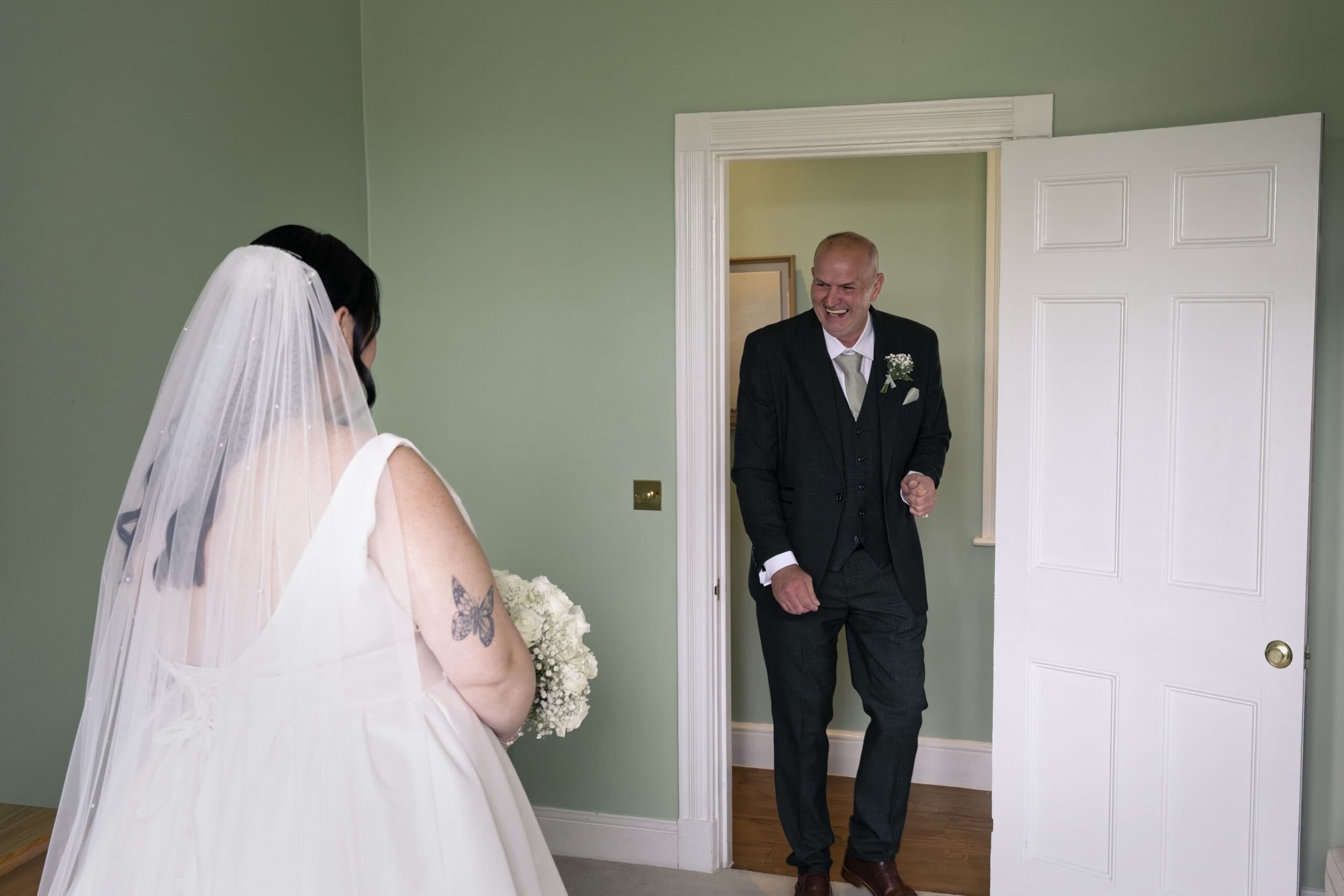 Bride's first look with her dad before the Northbrook Park ceremony