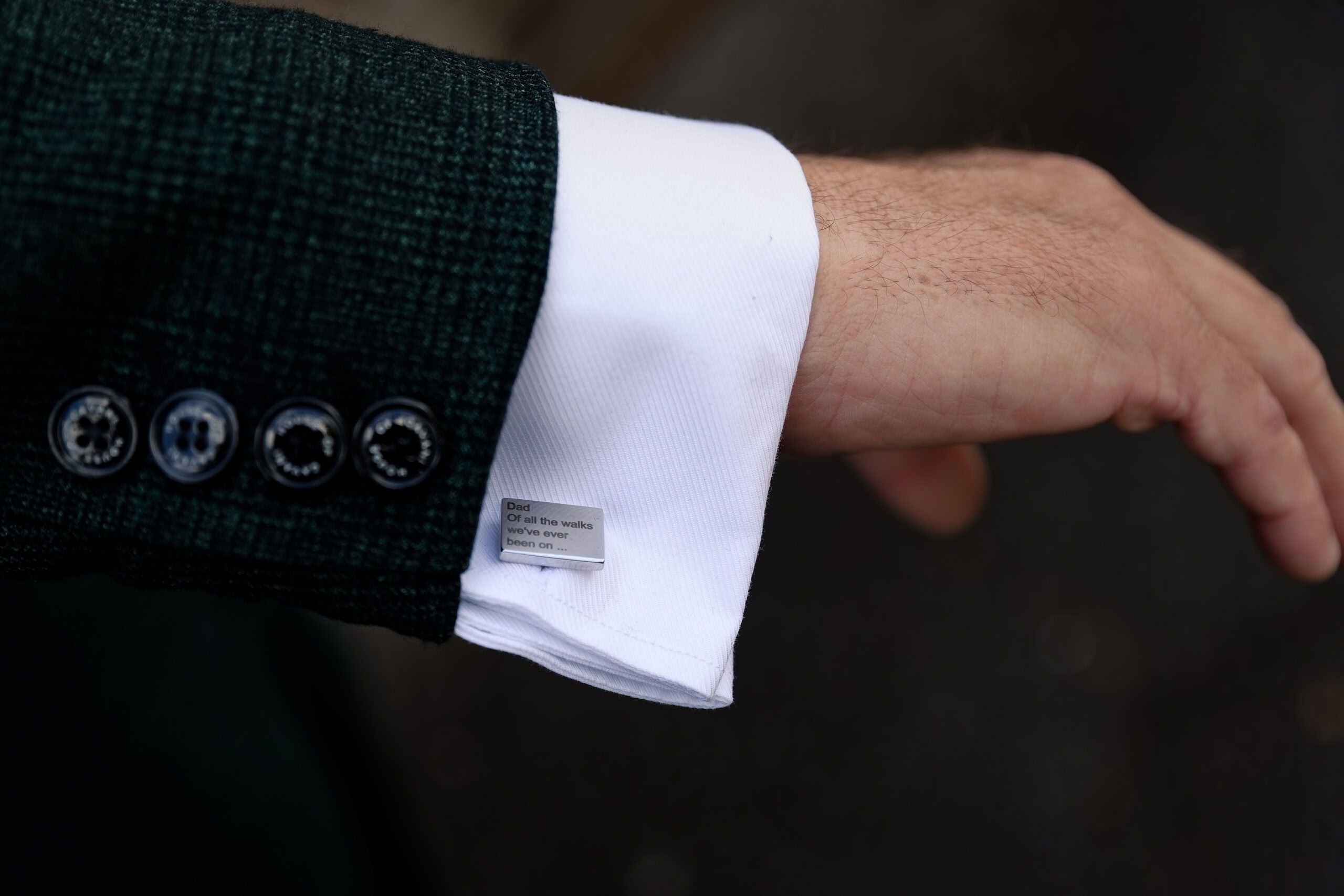 Detail shot of the groom's cufflink
