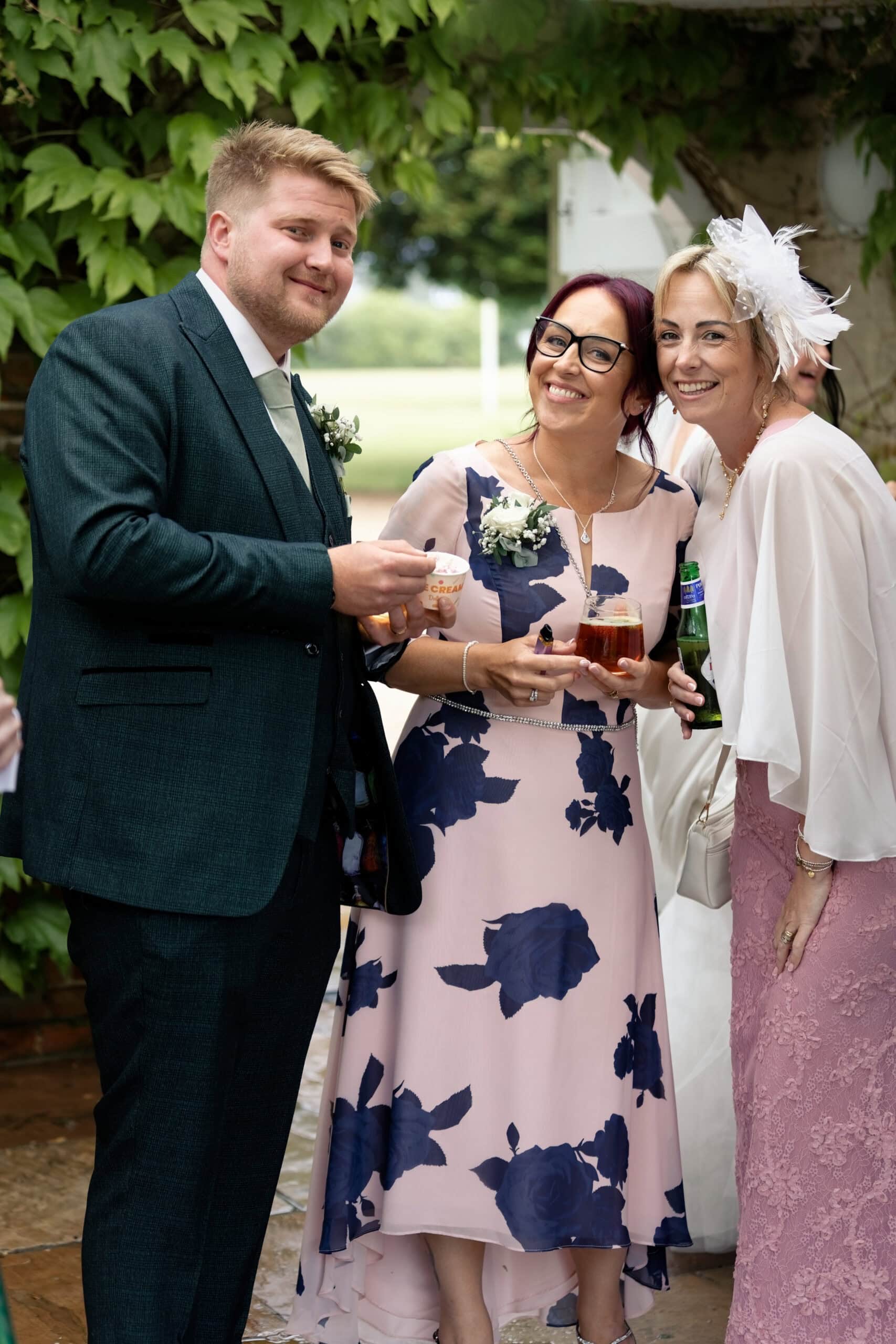 Groom chatting with guests during the drinks reception