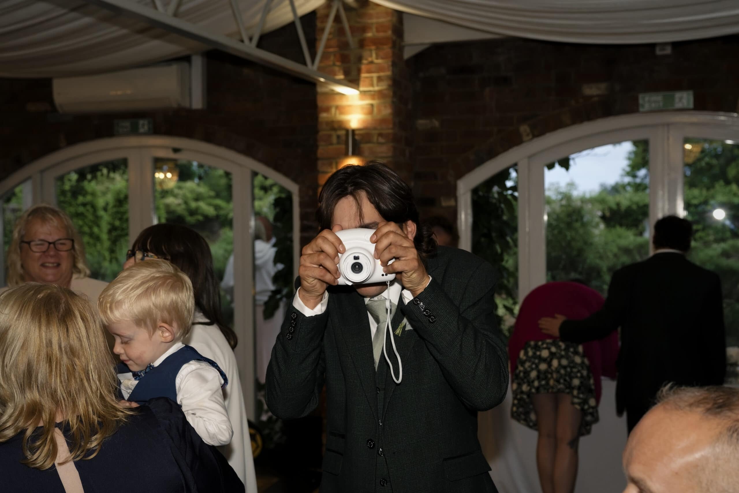Guest taking a photo on the dance floor