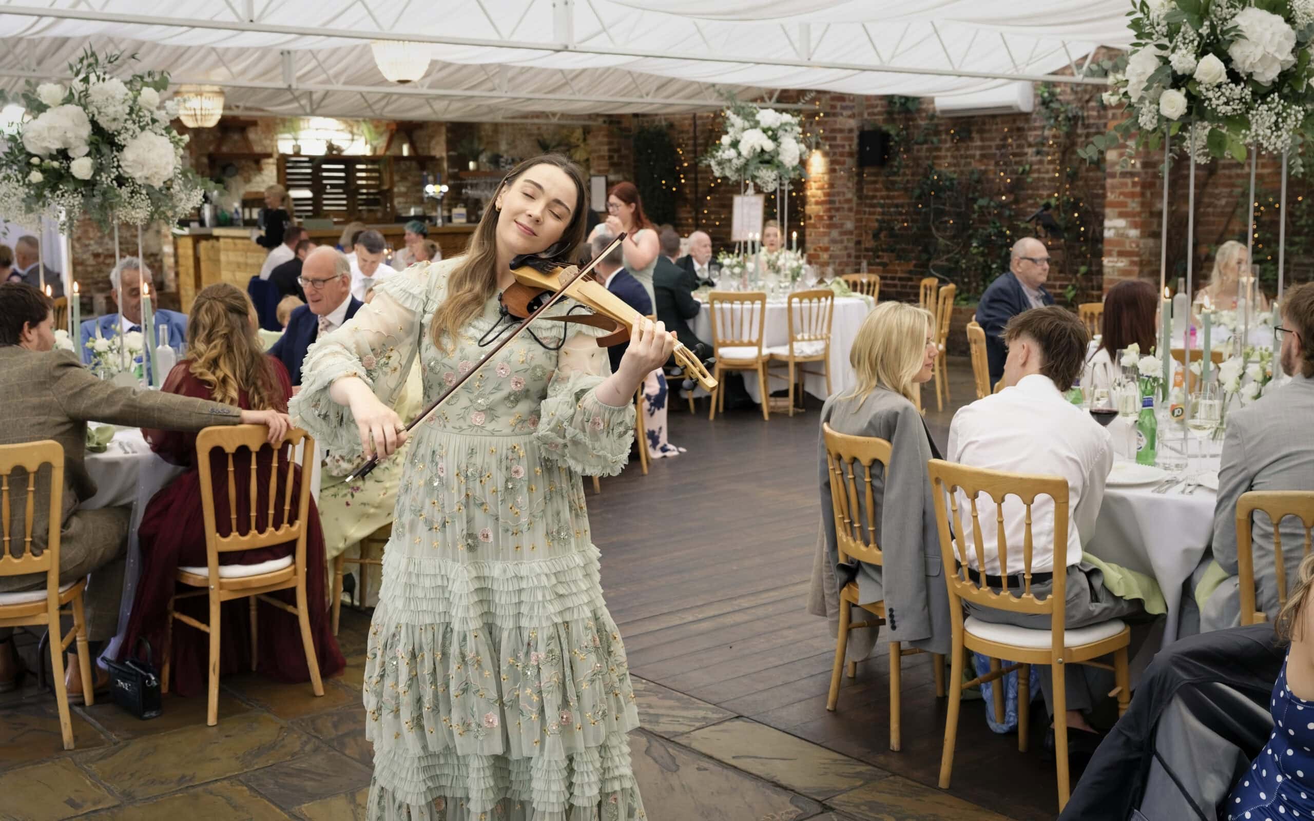 Live violinist performing during the wedding breakfast