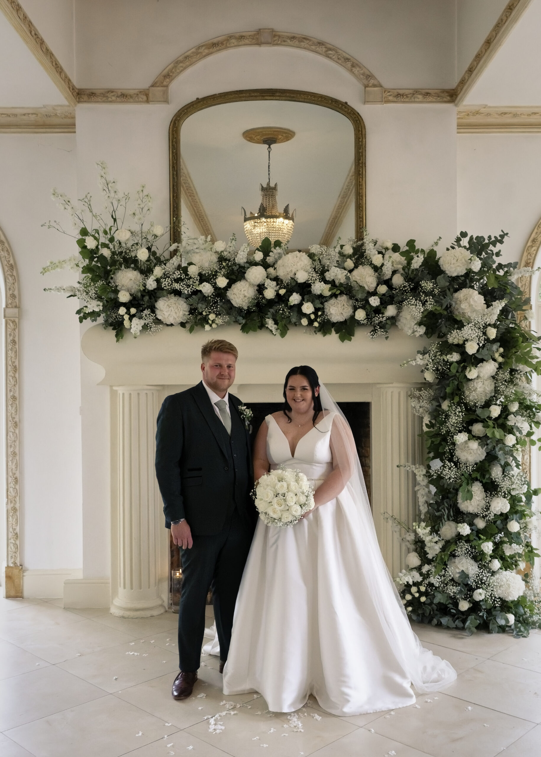 Newlyweds portrait beside the Vine Room fireplace