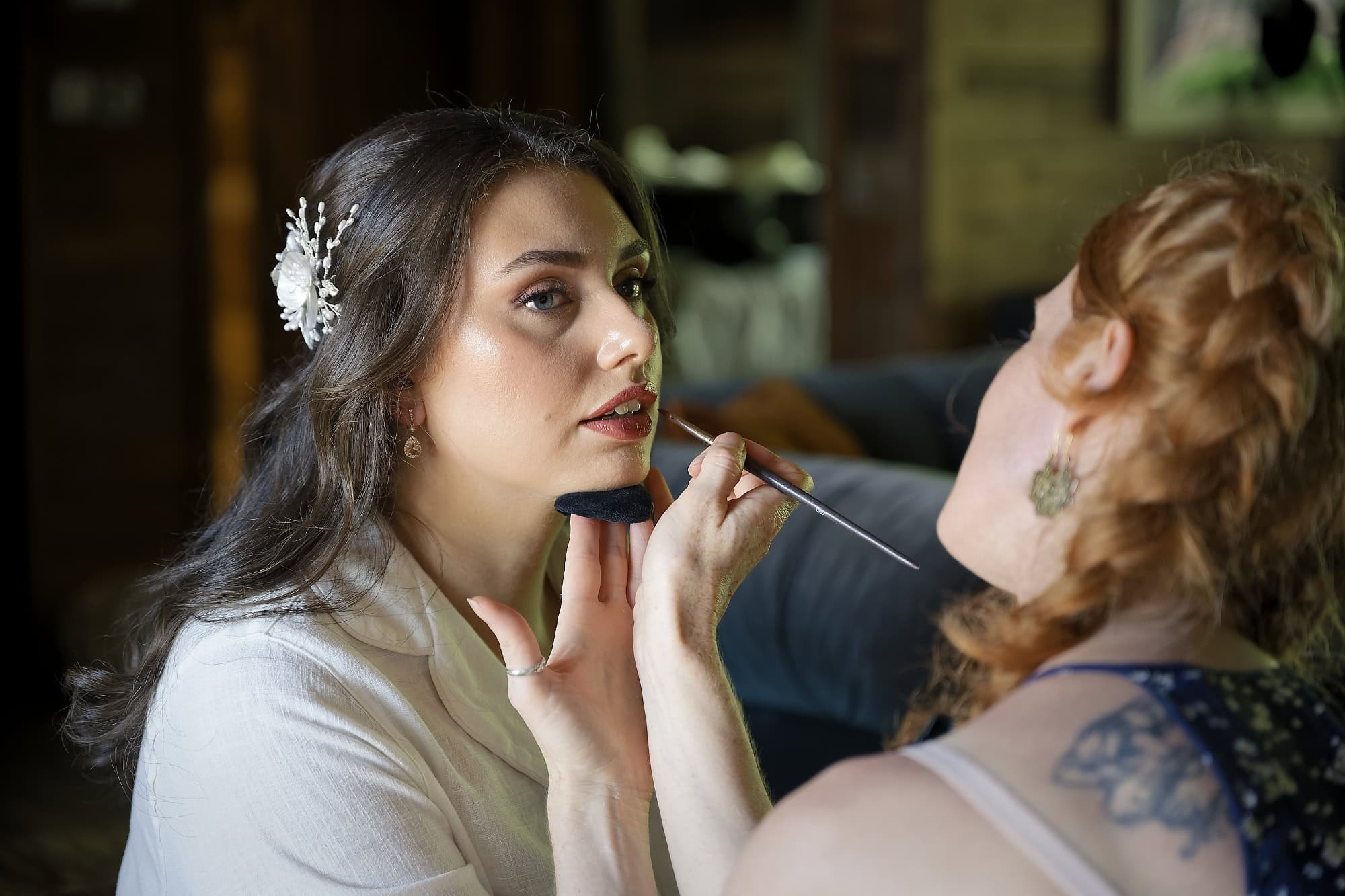 Bride having her makeup finished before a Port Lympne wedding