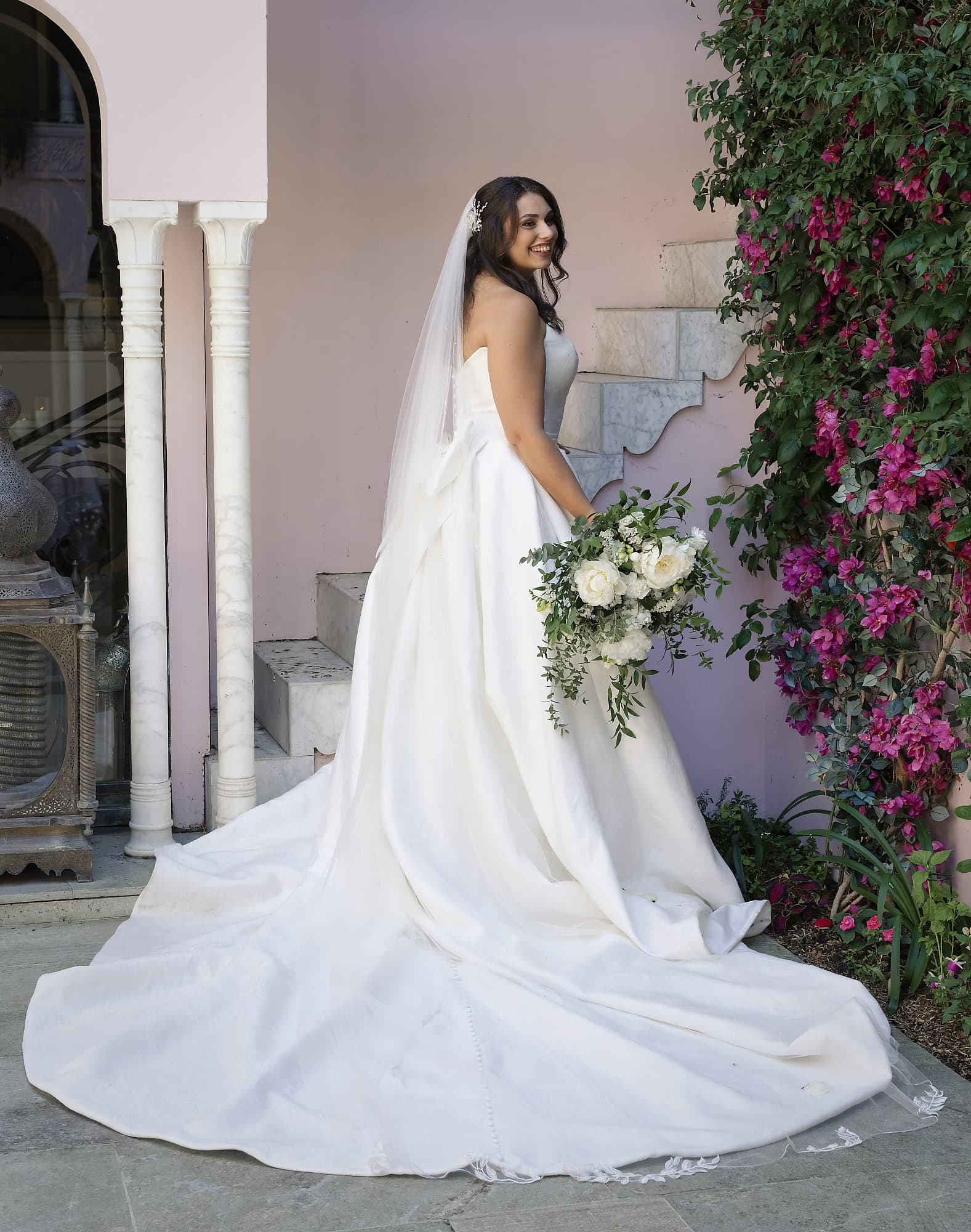 Bridal portrait next to a flowering Wall in the Moroccan Courtyard at Port Lympne