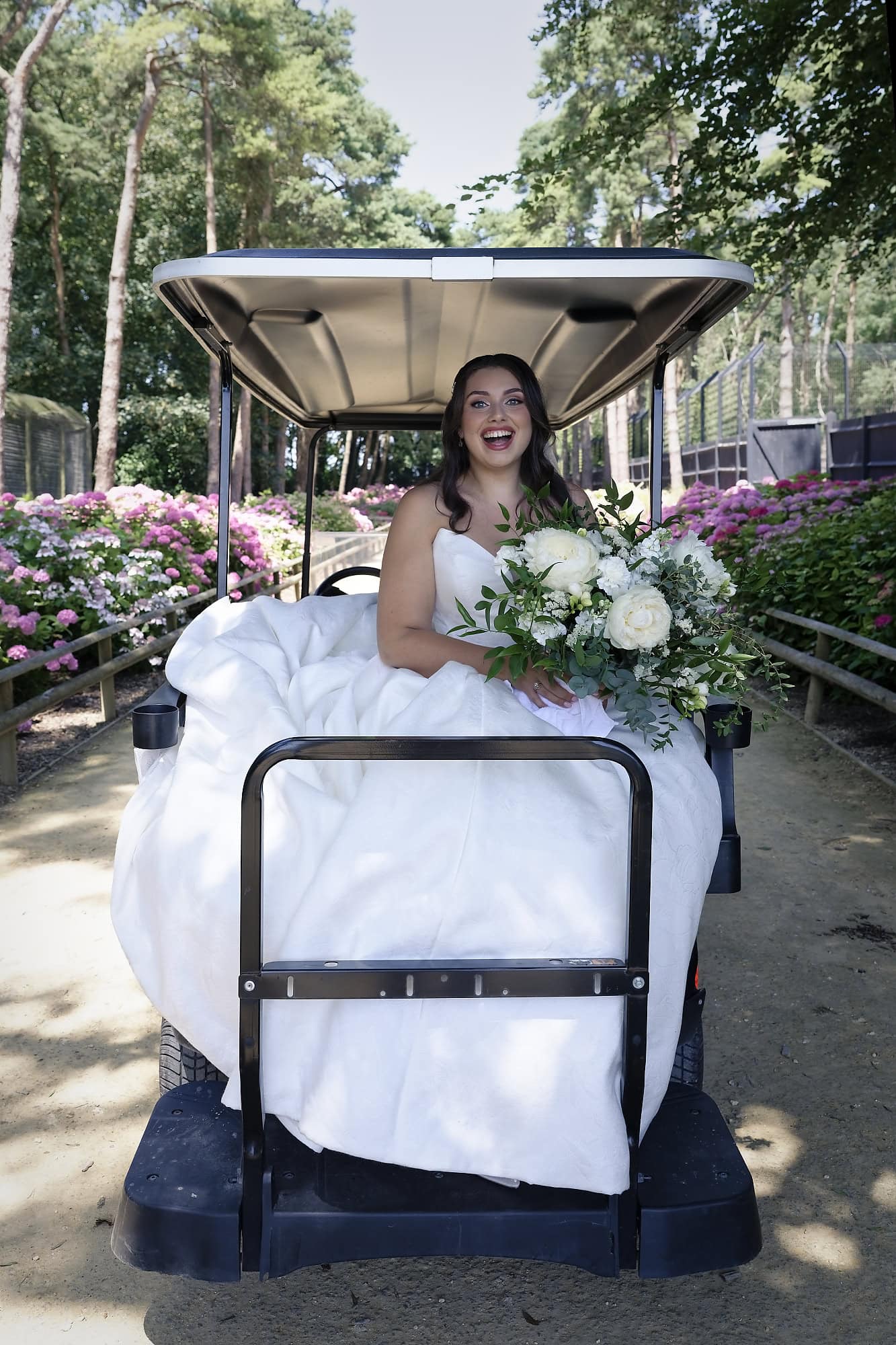 Bride heading to the Moroccan Courtyard by golf buggy after her first look with her grandad at Port Lympne