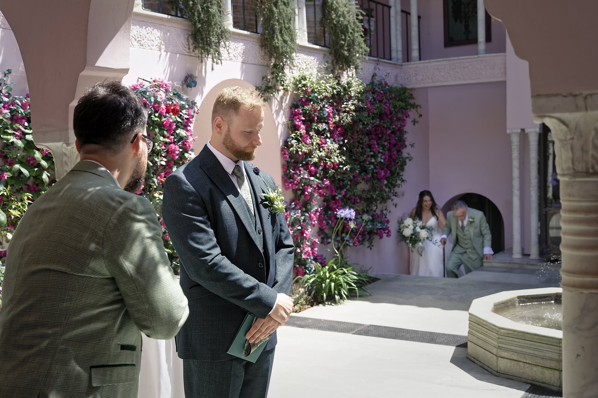 Groom waiting with his best man as the bride arrives in the Moroccan Courtyard