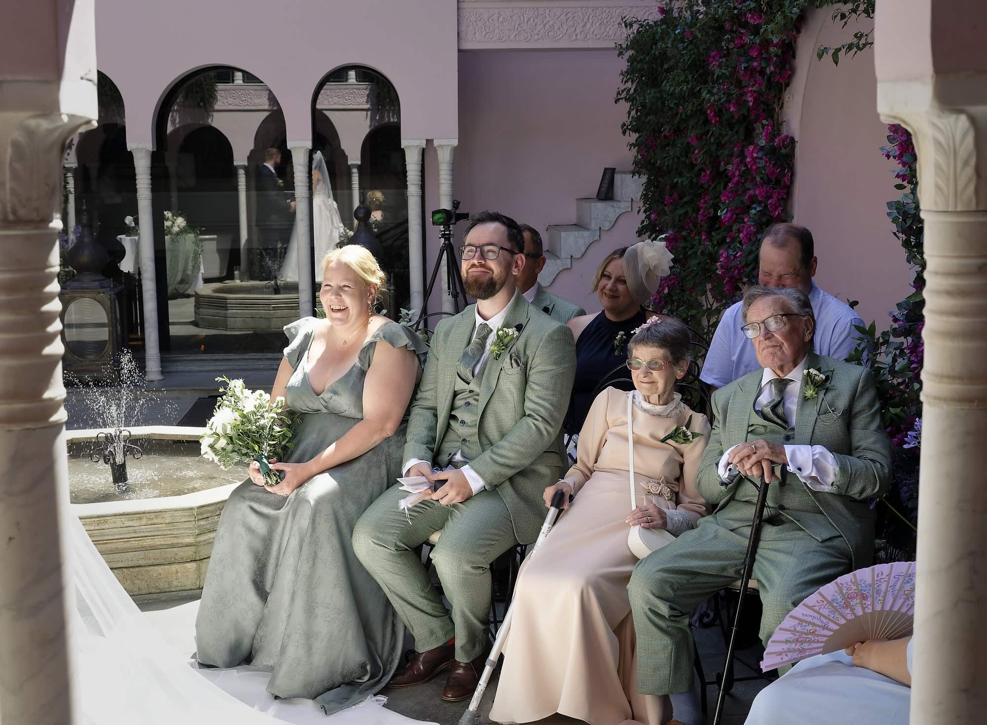 Wedding guests seated in the Moroccan Courtyard at Port Lympne