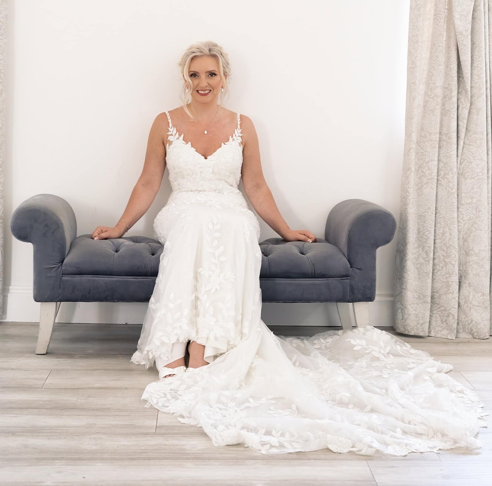 Bride seated in her wedding dress before the ceremony at The Ravenswood